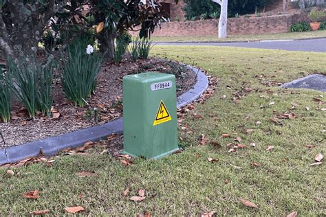 green electrical box in ground|green electricity box outside house.